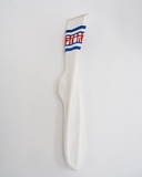 Jessi Strixner, Sportsocke, No. 2/10, 2024, Lindenholz geschnitzt, Acryl  35 x 12 x 5 cm